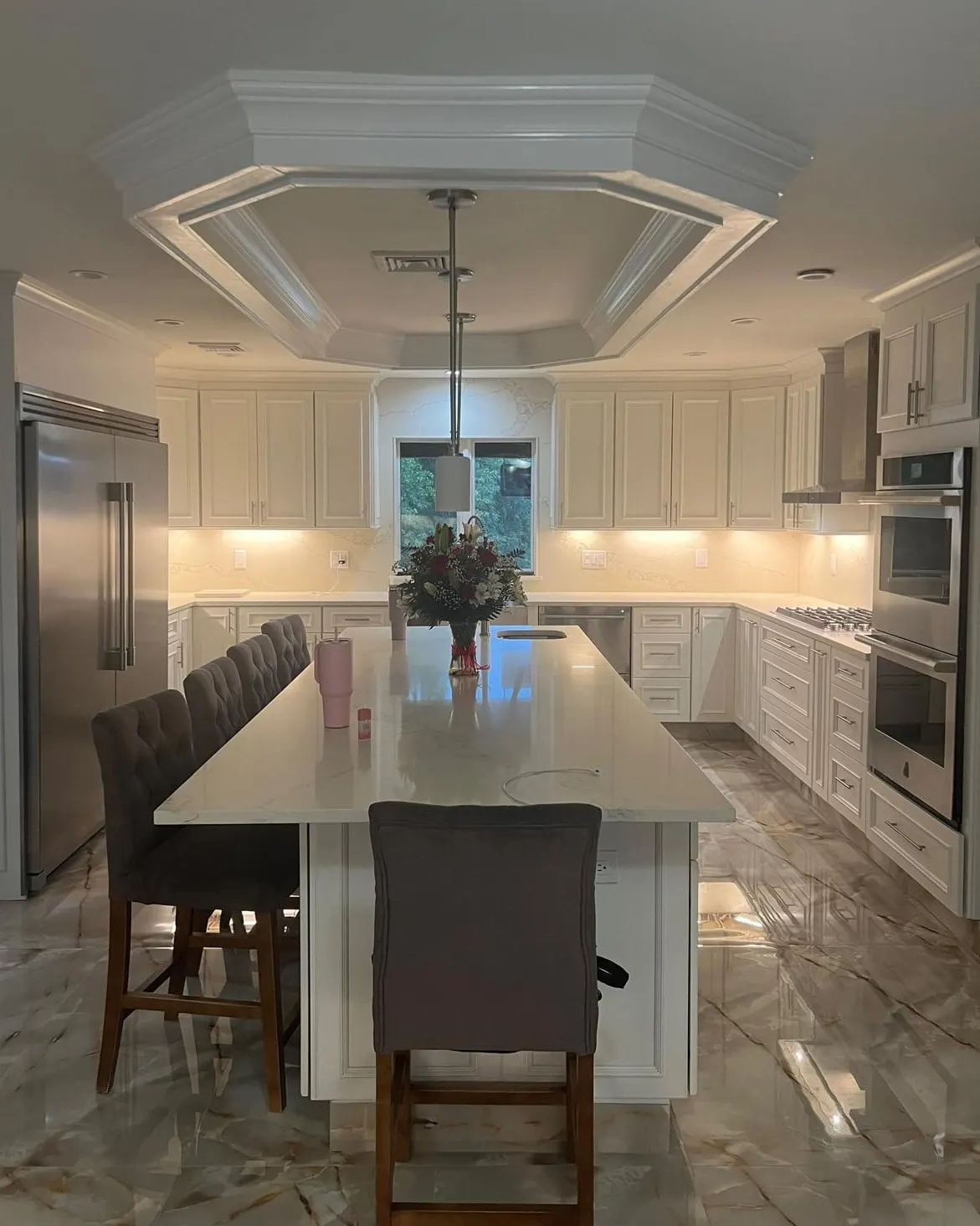 The same Clifton, NJ kitchen finished with white cabinets, a quartz island and an octagonal tray ceiling